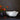 Beatriz Ball Vida Nube Melamine Bowl Large Lifestyle Image 2 shows the bowl placed on top of the table with flowers beside.