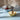 Alessi Joy Medium Fruit Bowl Lifestyle Image 1 shows a contemporary and vibrant centerpiece for your table, designed to hold and display a variety of fresh fruits while adding a cheerful and modern touch to your dining space.