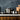 Mepra Stile By Pininfarina Plain Silver Deep Pot Lifestyle Image 1 combines sleek design with practicality, providing a stylish and functional cooking vessel for your culinary creations in a luxurious setting.