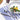 Nambe Frond 5-Piece Place Setting Lifestyle Image 1 shows an exquisite and nature-inspired dinnerware set that adds elegance to the dining table.