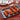 Staub Cast Iron Plancha/Double Burner Griddle Lifestyle Image 1 shows a versatile, large griddle that fits over two burners, perfect for grilling and cooking a variety of foods.