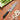 Miyabi Kaizen II 7-inch Santoku Knife Lifestyle Image 2 shows a masterfully crafted blade designed for superior cutting performance. This knife combines razor-sharp precision with a stylish design, bringing the art of Japanese cutlery to your kitchen.