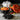 Staub Ceramic 16-oz. Petite Pumpkin Cocotte Lifestyle Image 3 shows a whimsical pumpkin-shaped cocotte in vibrant orange.
