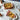 Staub 2-Piece Rectangular Baking Dish Set Lifestyle Image 2 shows a set of two durable and stylish baking dishes for all your oven-cooked dishes.
