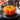 Staub Ceramic 24-oz. Pumpkin Cocotte Lifestyle Image 1 shows a ceramic cocotte in the shape of a pumpkin, perfect for autumn-inspired dishes.