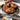 Staub Cast Iron 9.5" Vertical Chicken Roaster Lifestyle Image 3 shows a practical and stylish addition to your kitchen, ideal for a delicious roast chicken dinner.