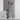 Orrefors Squeeze Tall Vase Lifestyle Image 2 shows a finely crafted crystal vase showcasing a contemporary squeezed pattern. This tall vase creates a striking visual impact, making it a perfect statement piece for showcasing your favorite blooms.