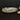Beatriz Ball Sierra Modern Tela Salad Servers Lifestyle Image 1 showing the salad servers placed on top of the platter.