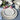 Carmel Ceramica Lily Valley Dinnerware 12-Piece Set Lifestyle Image 1 introduces floral elegance to your table, featuring beautifully crafted plates, bowls, and mugs that add a touch of nature-inspired charm to your dining experience in a coordinated and stylish design.