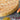Larch Wood Round Cutting Board Lifestyle Image 3 shows the zoomed-in view of the product.