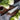 Miyabi Kaizen 7-inch Hollow Edge Rocking Santoku Knife Lifestyle Image 1 shows a precision-crafted blade and hollow edge design for effortless slicing and chopping. This knife seamlessly blends Japanese craftsmanship with modern innovation, offering both style and functionality in your kitchen.